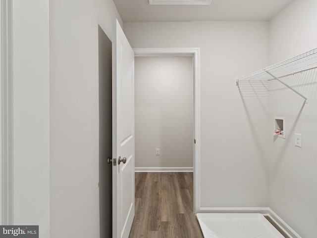 washroom with washer hookup and hardwood / wood-style flooring