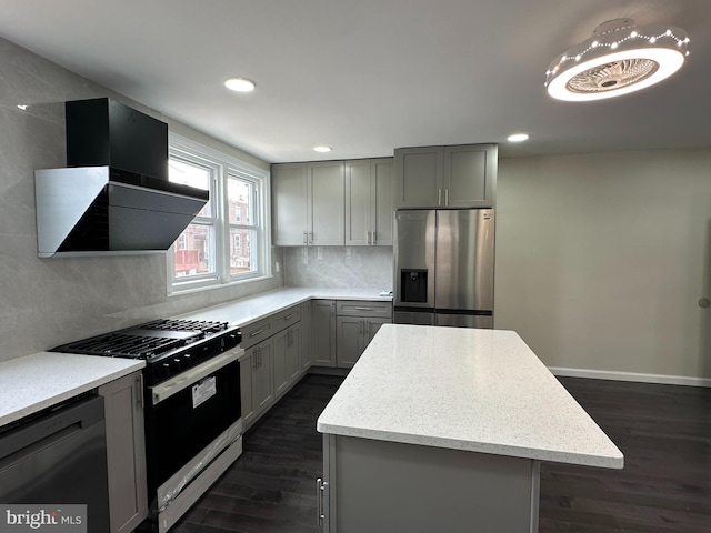 kitchen with wall chimney range hood, a center island, stainless steel refrigerator with ice dispenser, black dishwasher, and gas range