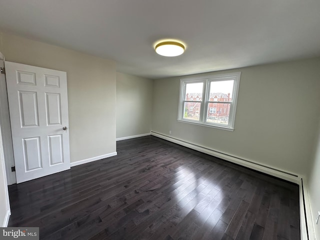 unfurnished room featuring dark hardwood / wood-style floors