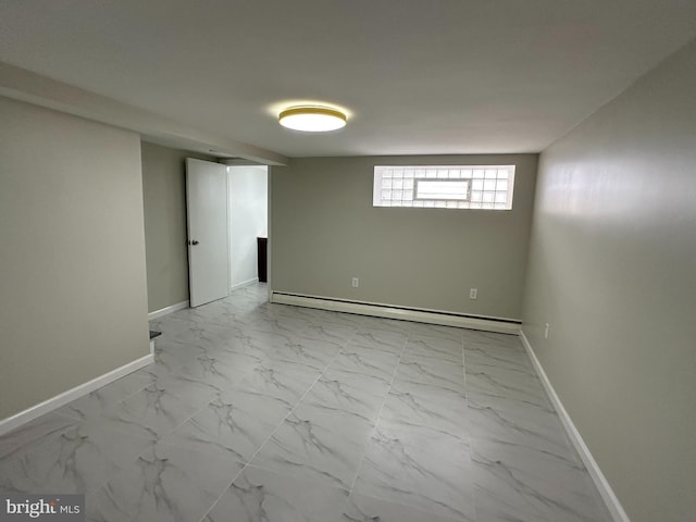 basement featuring a baseboard heating unit