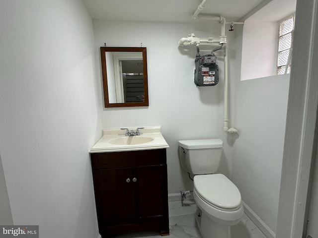 bathroom featuring toilet and vanity