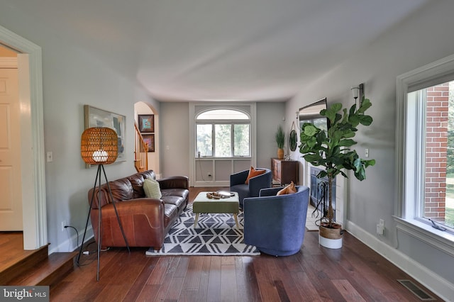 living room with dark hardwood / wood-style floors