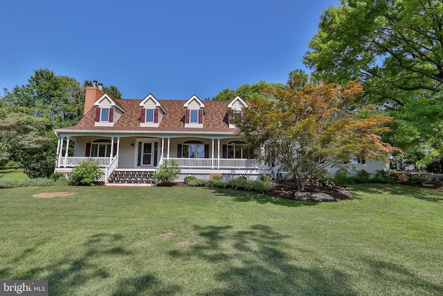 view of front of home featuring a front lawn and covered porch