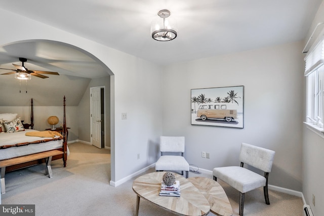 carpeted bedroom featuring ceiling fan, a baseboard radiator, and lofted ceiling