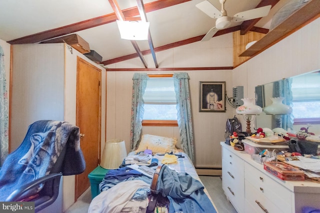 bedroom featuring baseboard heating, ceiling fan, multiple windows, and vaulted ceiling with beams