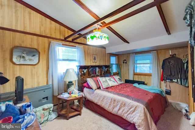 carpeted bedroom with lofted ceiling with beams, ceiling fan, and wood walls