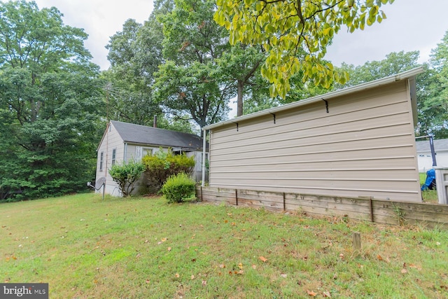 view of side of property with a lawn