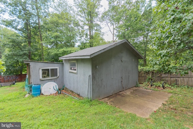 view of outdoor structure featuring a lawn