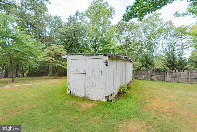 view of outdoor structure with a lawn