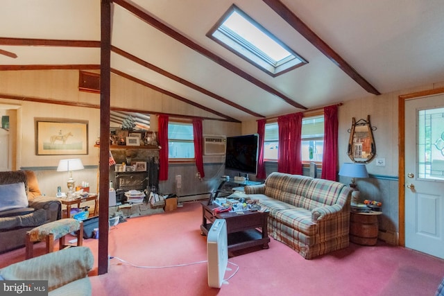 living room with lofted ceiling with skylight, carpet flooring, a baseboard radiator, and wood walls