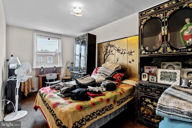 bedroom with dark colored carpet