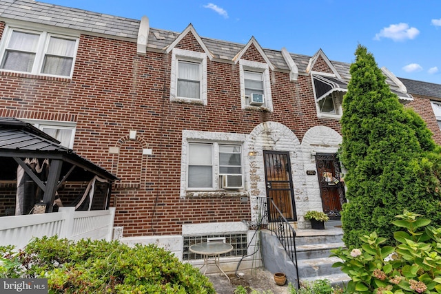 townhome / multi-family property with a gazebo