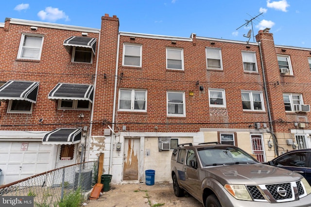 back of house featuring central air condition unit