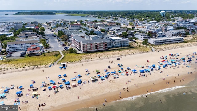 bird's eye view with a beach view and a water view