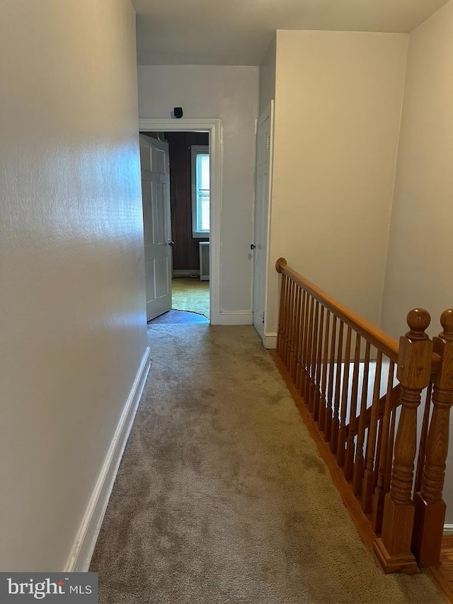 corridor with carpet floors