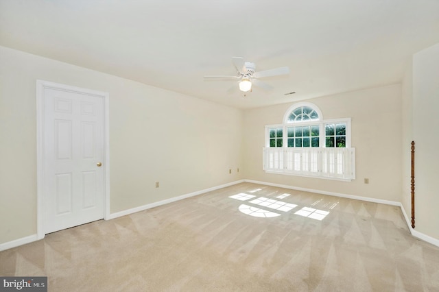 carpeted empty room with ceiling fan