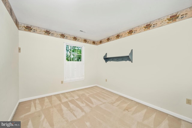 empty room featuring light colored carpet