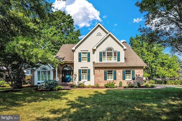 front facade with a front lawn