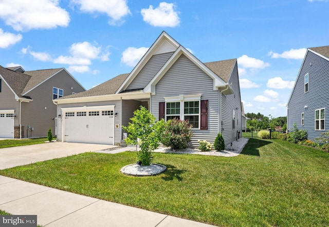 view of front facade with a garage and a front yard