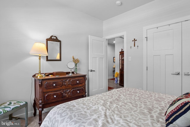 carpeted bedroom featuring a closet