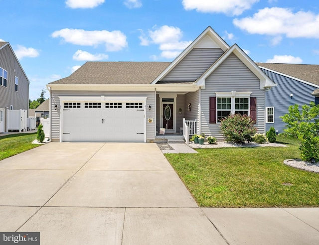 view of front of home with a garage and a front yard