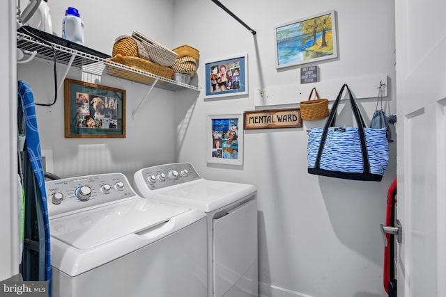 clothes washing area with washer and dryer