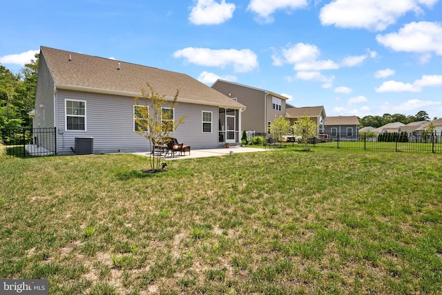 back of house featuring a yard, a patio, and cooling unit