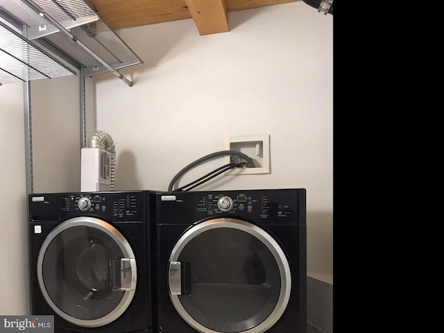 washroom featuring washer and clothes dryer