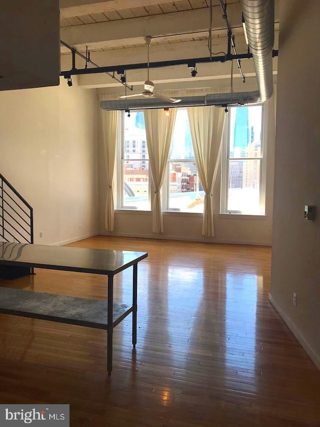 interior space featuring wood ceiling, hardwood / wood-style floors, and beamed ceiling