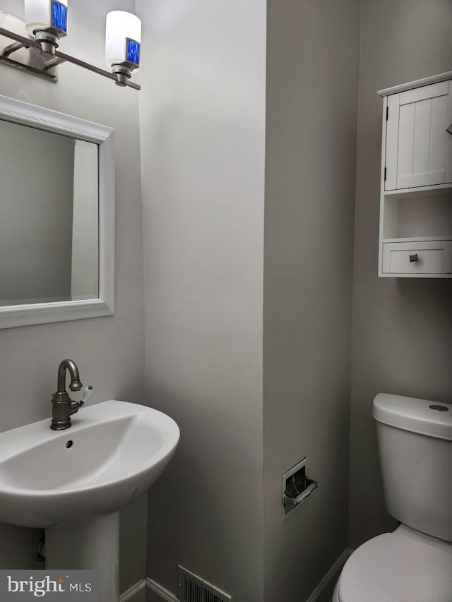 bathroom featuring sink and toilet