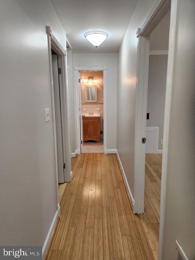 hallway featuring light hardwood / wood-style flooring