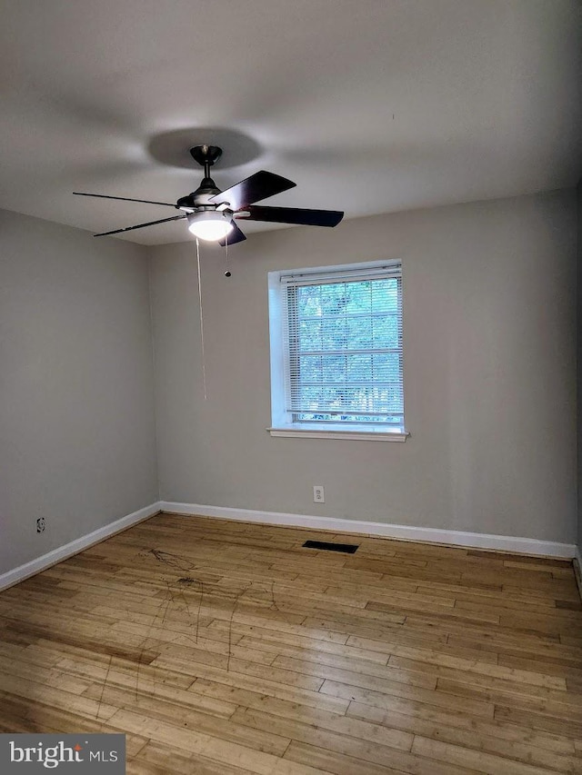 unfurnished room featuring ceiling fan and light hardwood / wood-style floors