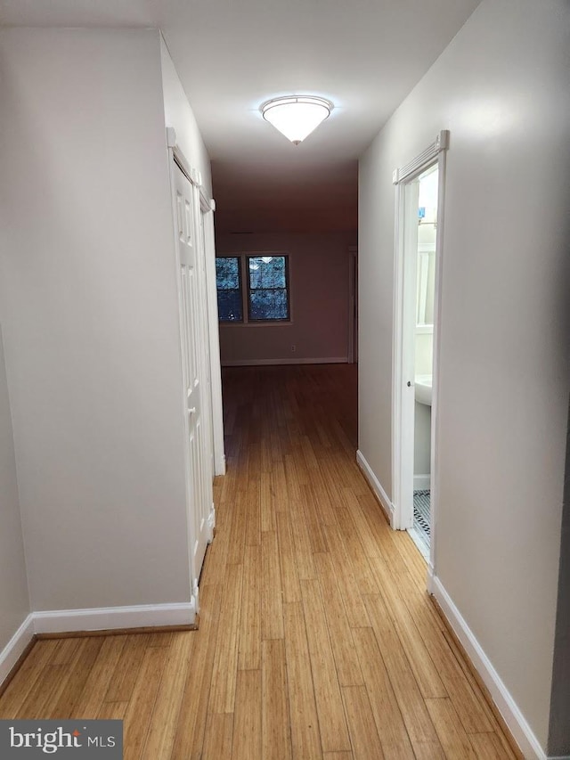 corridor featuring light wood-type flooring