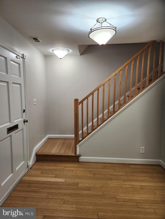 foyer with wood-type flooring