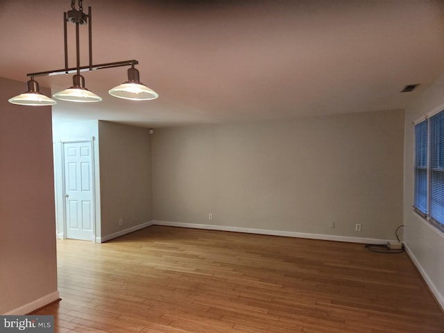 unfurnished room with light hardwood / wood-style flooring