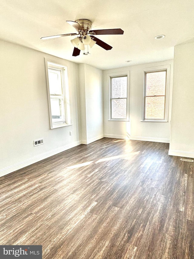 spare room featuring ceiling fan and hardwood / wood-style floors