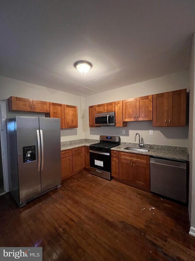 spare room with radiator, hardwood / wood-style flooring, and ceiling fan