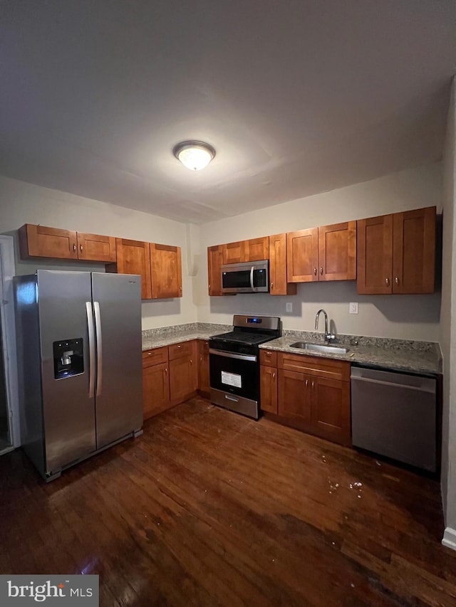 kitchen featuring sink, dark hardwood / wood-style floors, and stainless steel appliances