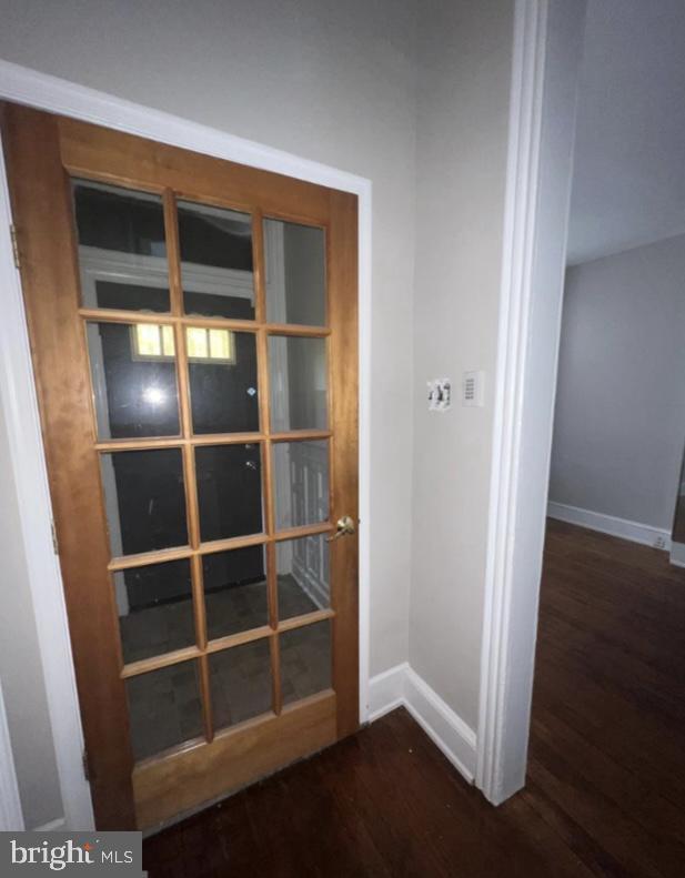 doorway to outside with dark hardwood / wood-style floors