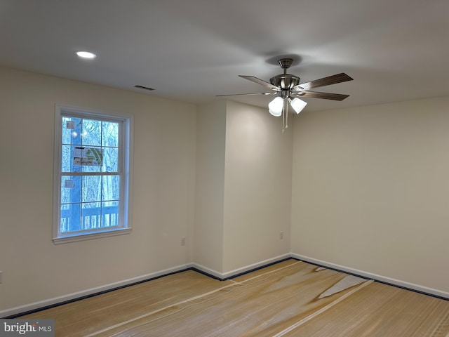 empty room featuring ceiling fan and light wood-type flooring