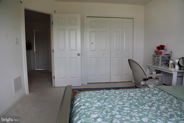 carpeted bedroom with a closet