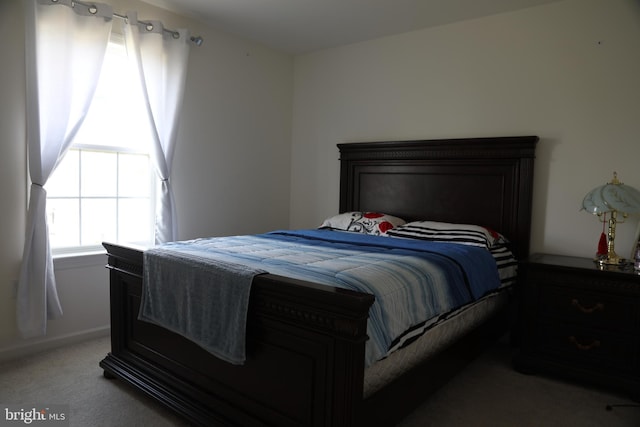 bedroom with light carpet