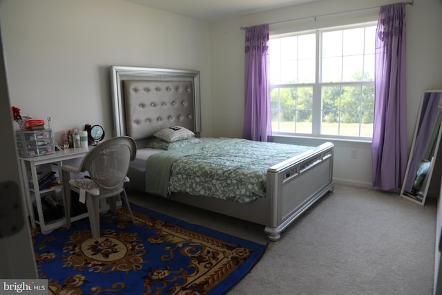 bedroom with light carpet