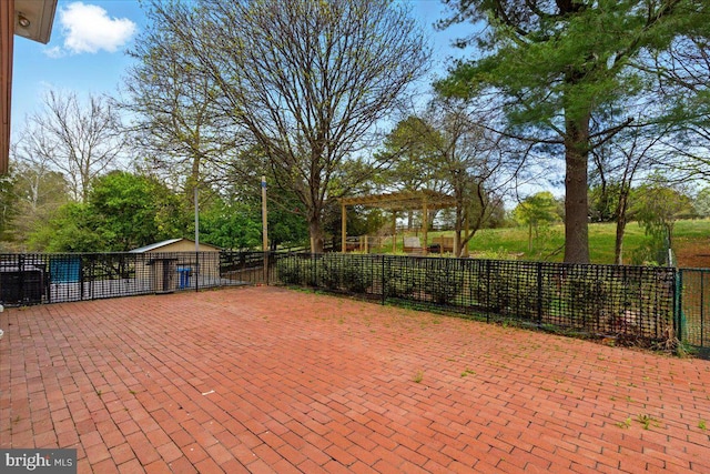 view of patio with a pergola, a carport, and fence
