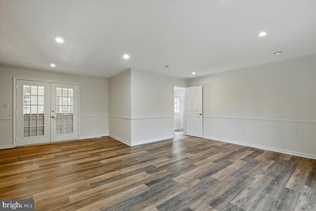 unfurnished room featuring wainscoting, french doors, wood finished floors, and recessed lighting