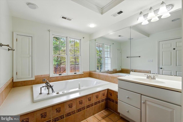 bathroom with tile patterned flooring, visible vents, a garden tub, and vanity