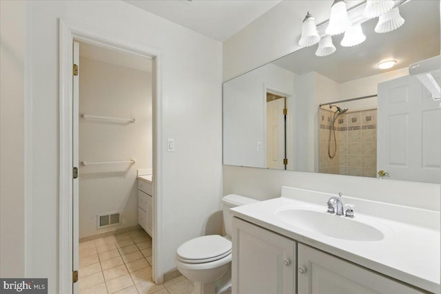 full bath featuring tile patterned floors, visible vents, toilet, vanity, and walk in shower