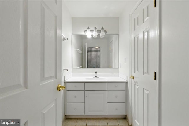 bathroom with vanity and tile patterned flooring