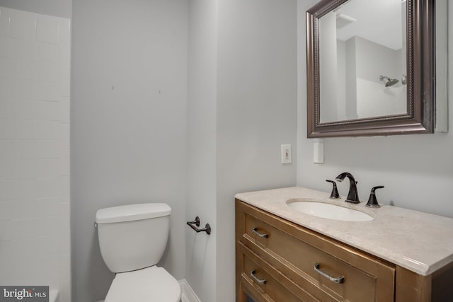 bathroom featuring toilet and vanity