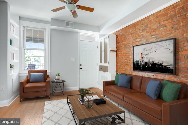 living room with ceiling fan and light hardwood / wood-style floors